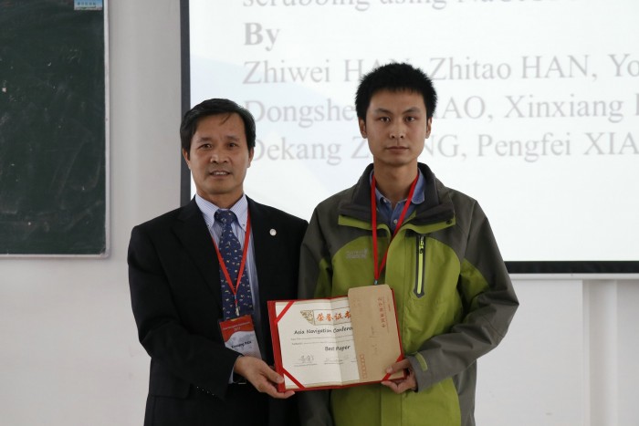 Pan Xinxiang, the vice president of DMU issues the certification to the Author of the Best Paper