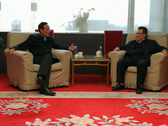 Chairman Huang Youfang talks with NMC Director Wang Chunfa